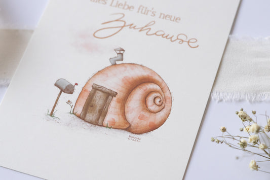 Postkarte mit Illustration eines Schneckenhauses und dem Text „Alles Liebe fürs neue Zuhause“ – Grußkarte zum Einzug oder Umzug