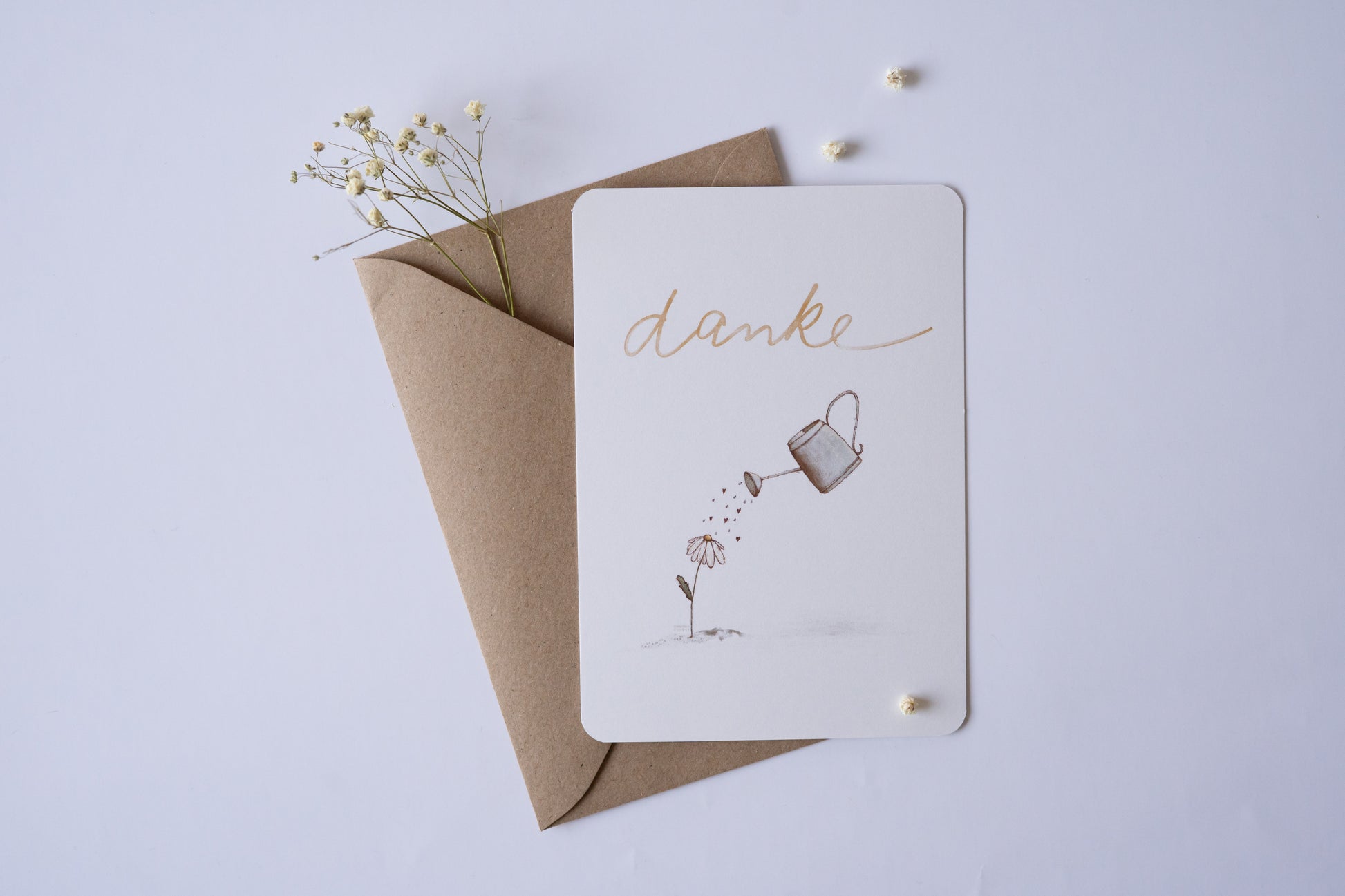 Postkarte Danke mit Illustration einer Blume und Gießkanne – zarte Dankeskarte